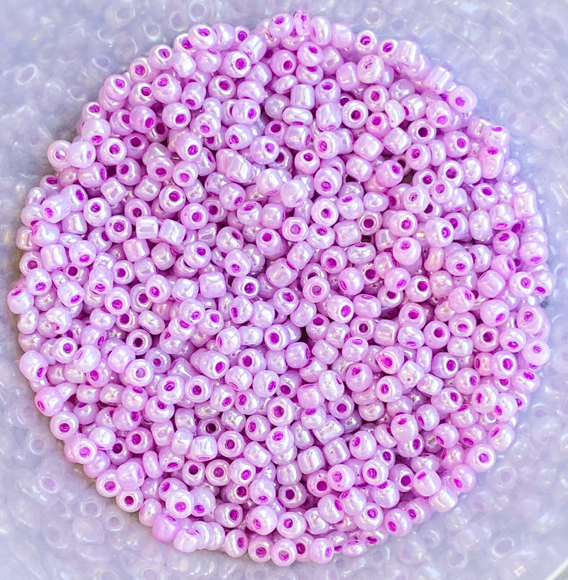 6/0 Ceylon Lilic with Fushia Inlay